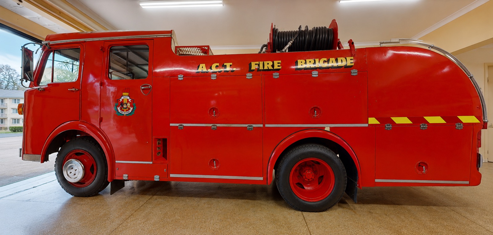 1969 Dennis Jaguar fire truck side profile inside the museum