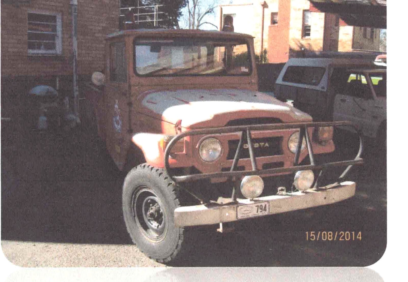 1974 Toyota Land Cruiser FJ40 light bush fire truck outside Forrest Fire Station